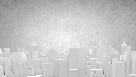 Conceptual image with construction model of buildings on tableの写真素材