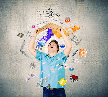 Young man with opened book. Reading and educationの写真素材