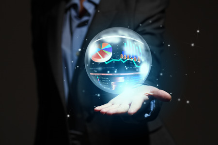 Close up of businesswoman holding graphs in handの写真素材