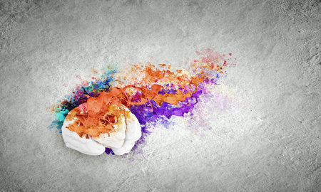 Conceptual image of human brain in colorful splashesの写真素材