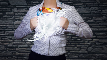 Young woman tearing shirt on chest. Idea conceptの写真素材