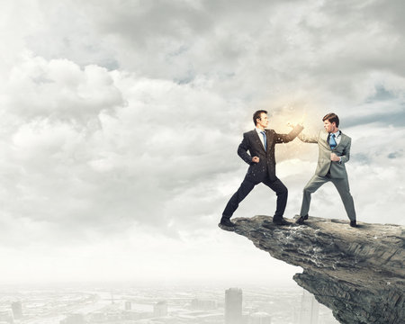 Two furious businessman fighting with each other