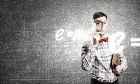 Young funny science man looking in magnifier
