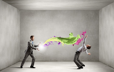 Two business people fighting with each otherの写真素材