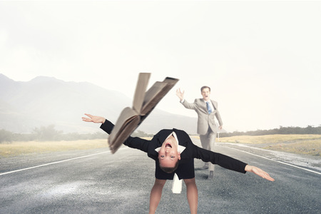 Two business people fighting with each otherの写真素材