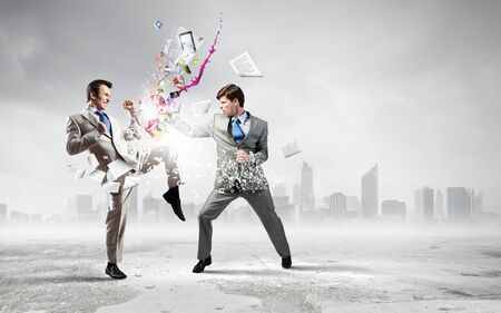 Two furious businessman fighting with each otherの写真素材