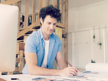 Man working with drafts in office