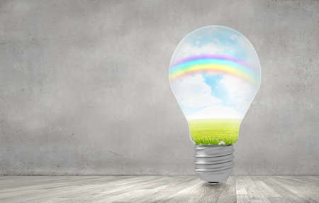 Lightbulb with beautiful landscape insideの写真素材