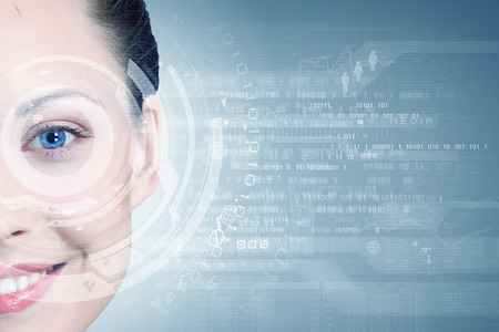 Close up of woman eye with digital iconsの写真素材