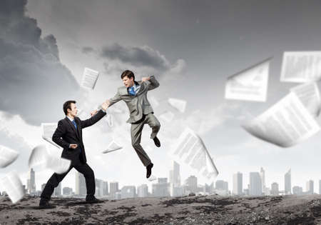 Two furious businessman fighting with each otherの写真素材