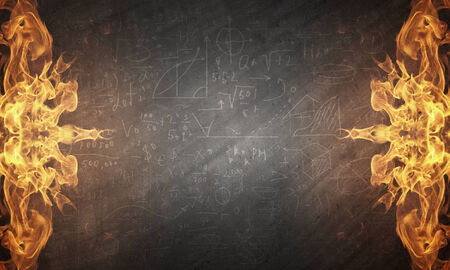 Conceptual image of burning fire on dark backgroundの写真素材