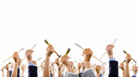 Group of business people hands holding paint brush