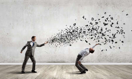 Two business people fighting with each otherの写真素材