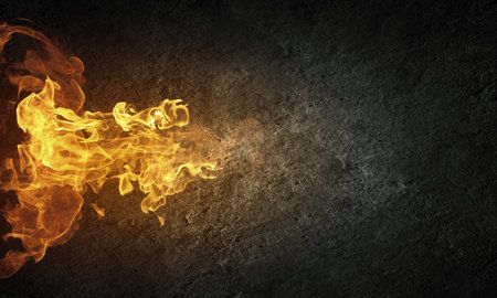 Conceptual image of burning fire on dark background