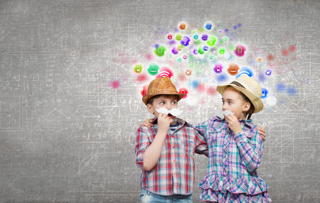 Cute girl and boy wearing shirt hat and mustacheの写真素材