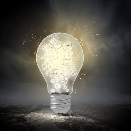 Conceptual image with light bulb and gears inside