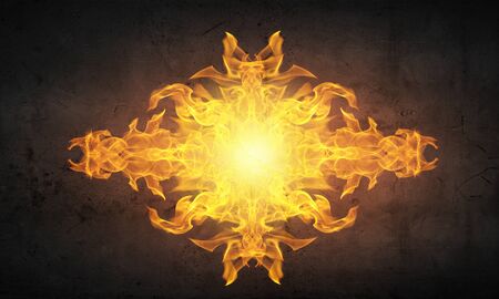 Conceptual image of burning fire on dark backgroundの写真素材