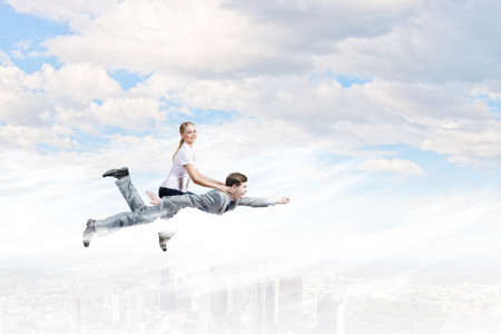 Young girl riding on back of her manの写真素材