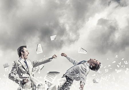 Two furious businessman fighting with each other