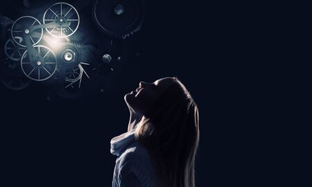 Cute girl of school age against night backgroundの写真素材
