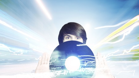 Young handsome man dj holding disco plateの写真素材