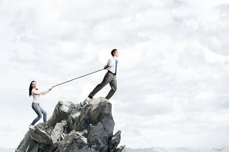 Young man on lead of woman trying to escapeの写真素材