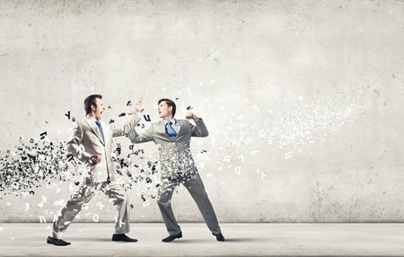 Two furious businessman fighting with each otherの写真素材