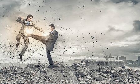 Two furious businessman fighting with each otherの写真素材