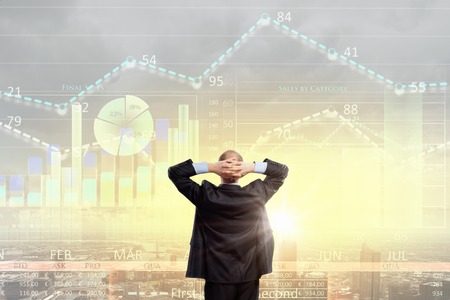 Rear view of businessman looking at business strategy sketchの写真素材