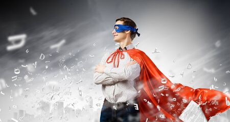 Young man wearing   mask and capeの写真素材