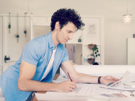 Man working with drafts in office