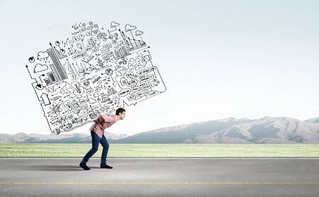 Young businessman carrying out ideas of business planの写真素材