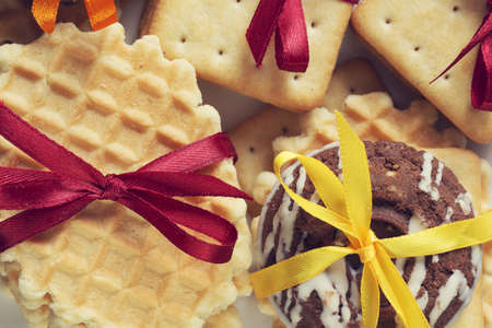 Stack of delicious cookies on table tied with ribbonの写真素材