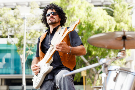 A street musician playing his guitar