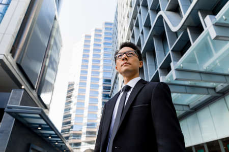 Businessman outdoors in city business districtの写真素材
