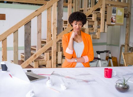 Young female engineer working in officeの写真素材
