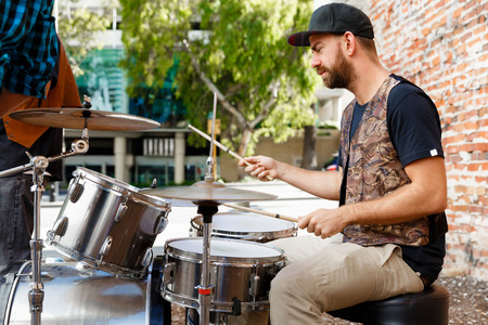 A street muscian playing drumsの写真素材