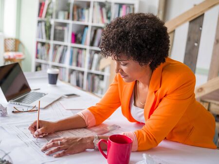 Young female engineer working in officeの写真素材