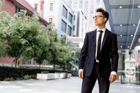 Businessman outdoors in city business districtの写真素材