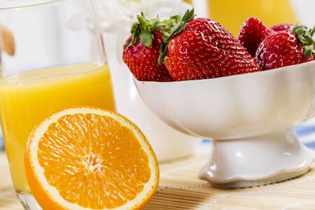 Breakfast with assortment of pastries, coffees and fresh strawberriesの写真素材