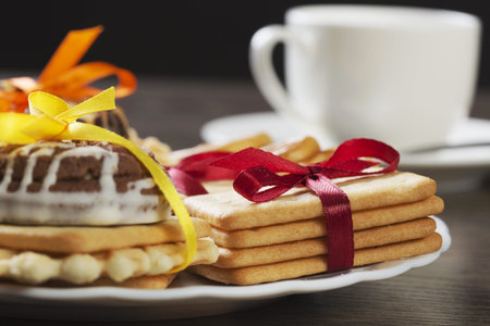 Stack of delicious cookies on table tied with ribbon