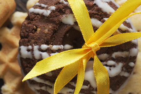 Stack of delicious cookies on table tied with ribbon