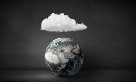 Earth planet and white cloud above it. Elements of this image are furnished by NASAの写真素材