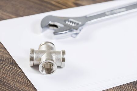 All kinds of plumbing and tools on sheet of paperの写真素材