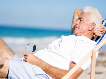 Handsome man on the beachの写真素材