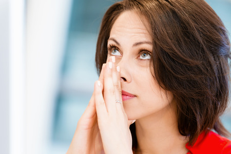 Modern business woman thinking about somethingの写真素材