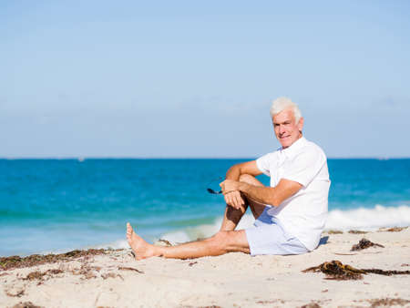 Handsome man on the beachの写真素材