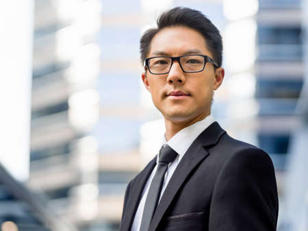 Businessman outdoors in city business districtの写真素材