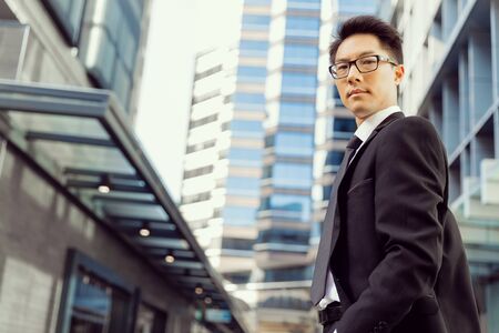 Businessman outdoors in city business districtの写真素材