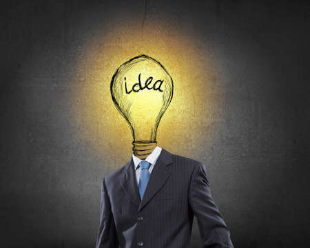 Businessman with light bulb instead of headの写真素材